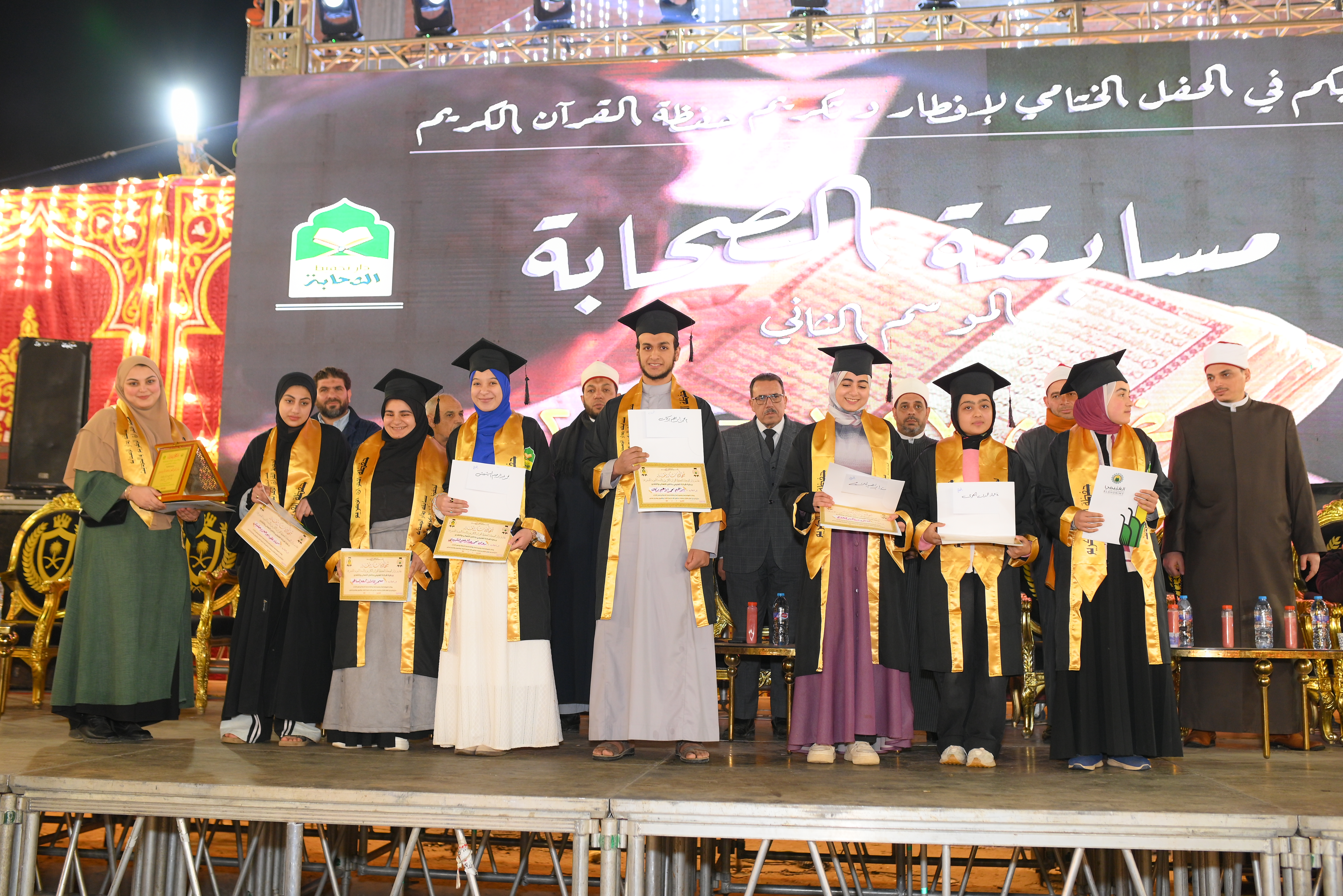 Winners holding certificates of appreciation