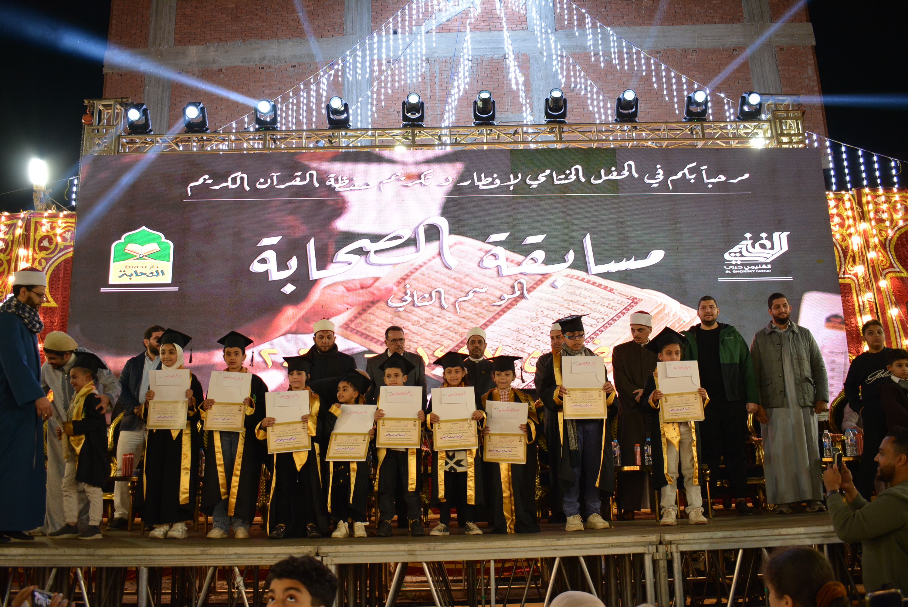 Kids winners receiving certificates on stage